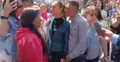 A man tries to kiss Mexico's female President Claudia Sheinbaum