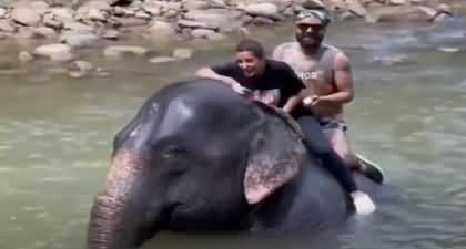 Actress Iqra Aziz and Yasir Hussain enjoying elephant ride in vacations