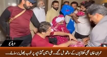 Chairman PTI Imran Khan showered flowers on Ali Amin Gandapur