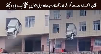China: Out-of-control truck ends up hanging from building’s second floor