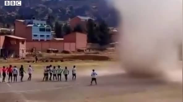 Dust Devil Almost Takes Out Football Players at Match in Bolivia