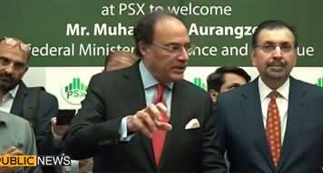Finance Minister Muhammad Aurangzeb talks to journalists at Pakistan stock exchange