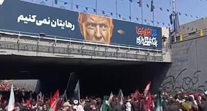 Iranian mourners attack with stones at Trump's photo in Khamenei farewell