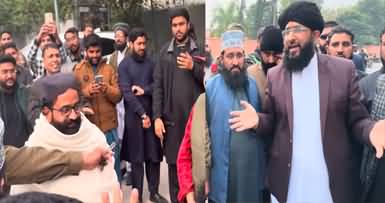 Mufti Hanif Qureshi talks to people outside the academy of Engineer Muhammad Ali Mirza