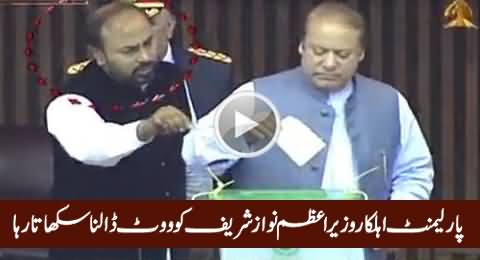 Parliament Employee Teaching PM Nawaz Sharif How To Cast Vote