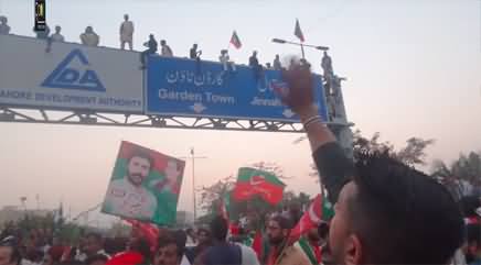People climbed the signboard, during Imran Khan's long march