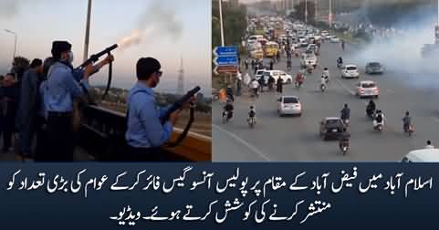 Police trying to disperse crowd at Faizabad, Islamabad by firing tear gas shells