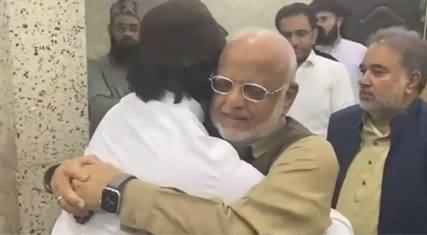 PTI leader Ijaz Chaudhry hugging TLP head Saad Hussain Rizvi