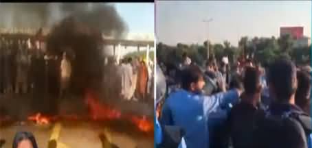 PTI workers protest on Murree Road in Faizabad against Imran Khan's disqualification