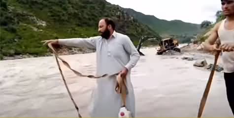 See How Civil Defence Team Rescued The Boy in Swat Who Was Stuck in Flood