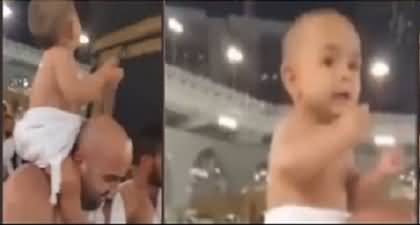 Video of a cute little baby Performing Hajj on his father's shoulder goes viral