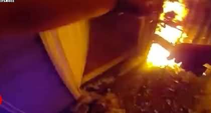 Video: Police officer knocks down burning door and rescues mother and two children in Tennessee